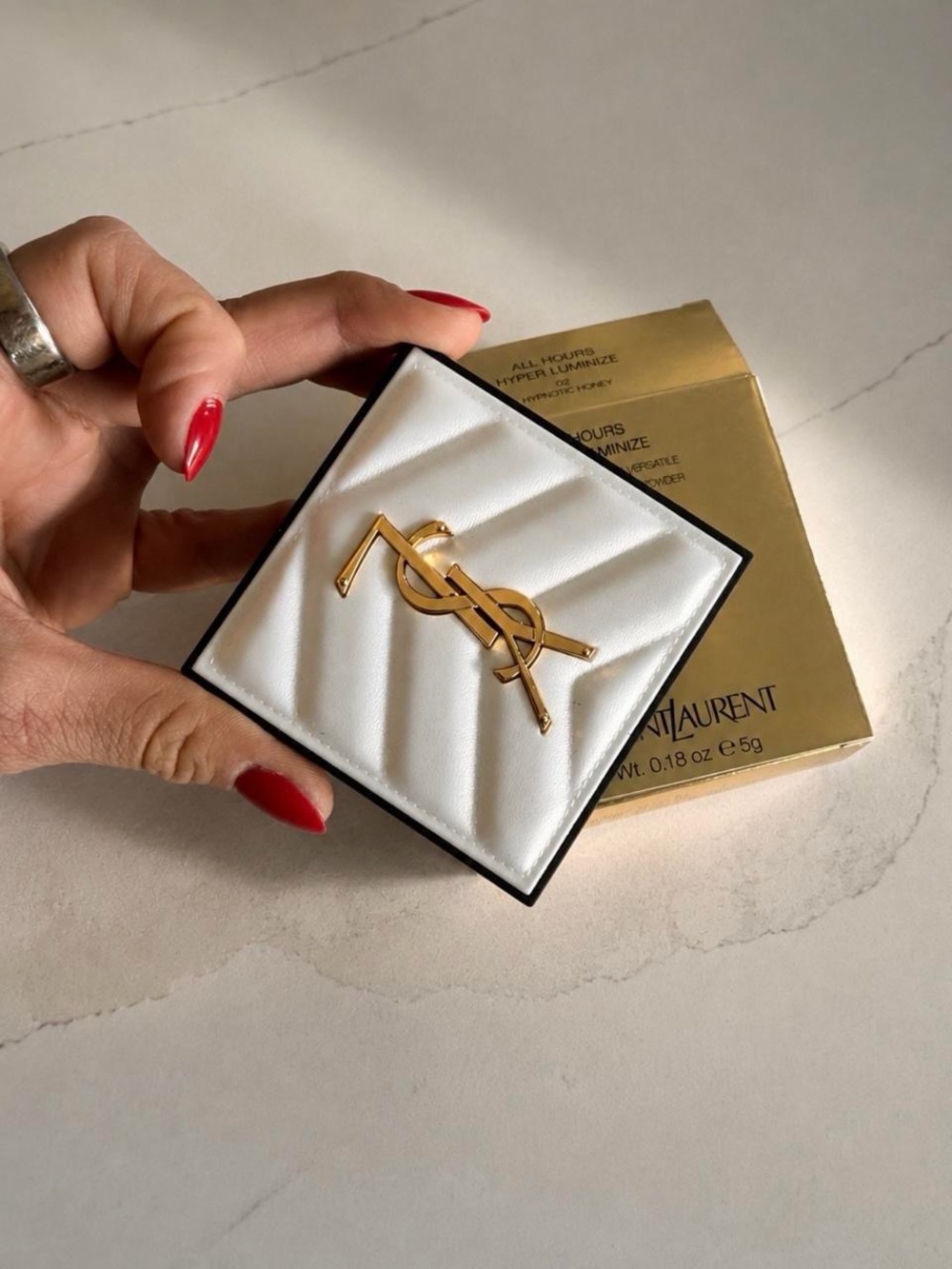 Yves Saint Laurent Gold Monogram Highlighter on White Quilted Backing